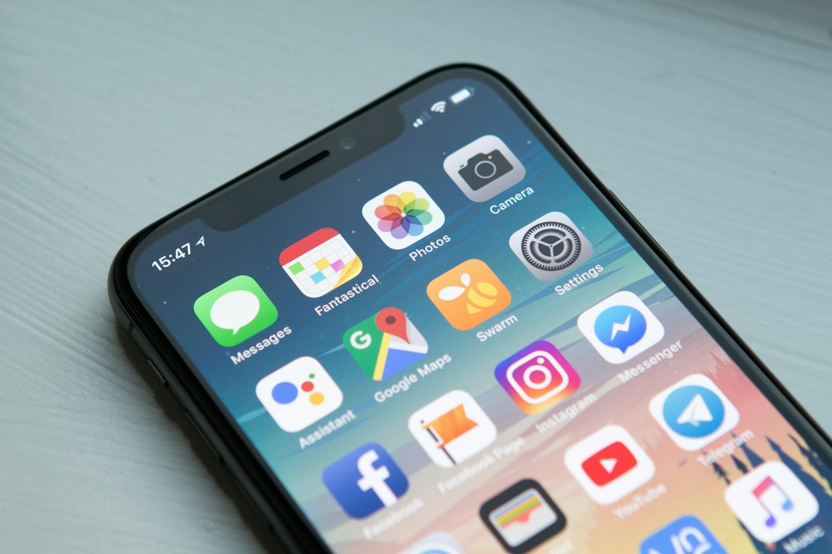Smartphone home screen with many app icons
