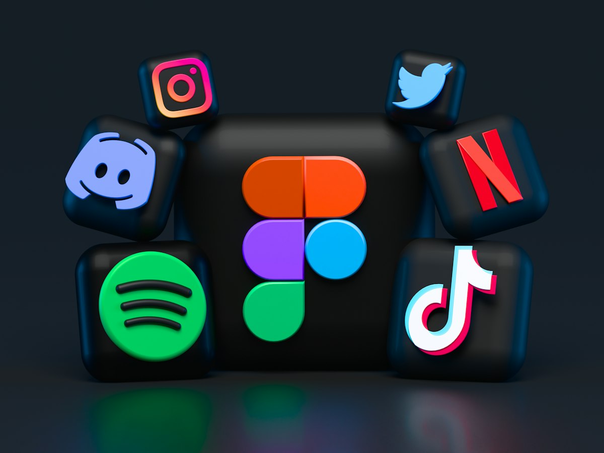 Three-dimensional social media app icons on a dark background